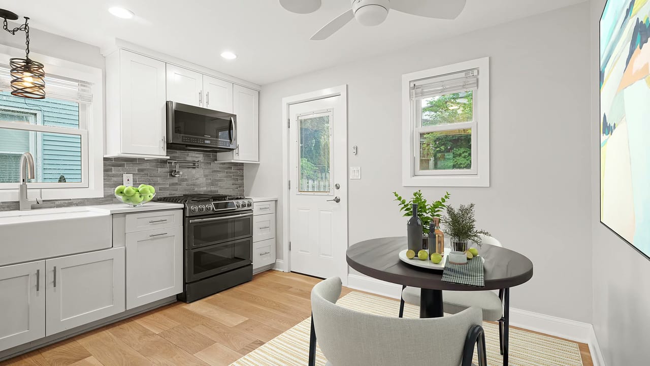 A styled kitchen and dining nook at a Fix and Fashion listing, set for the listing photo shoot
