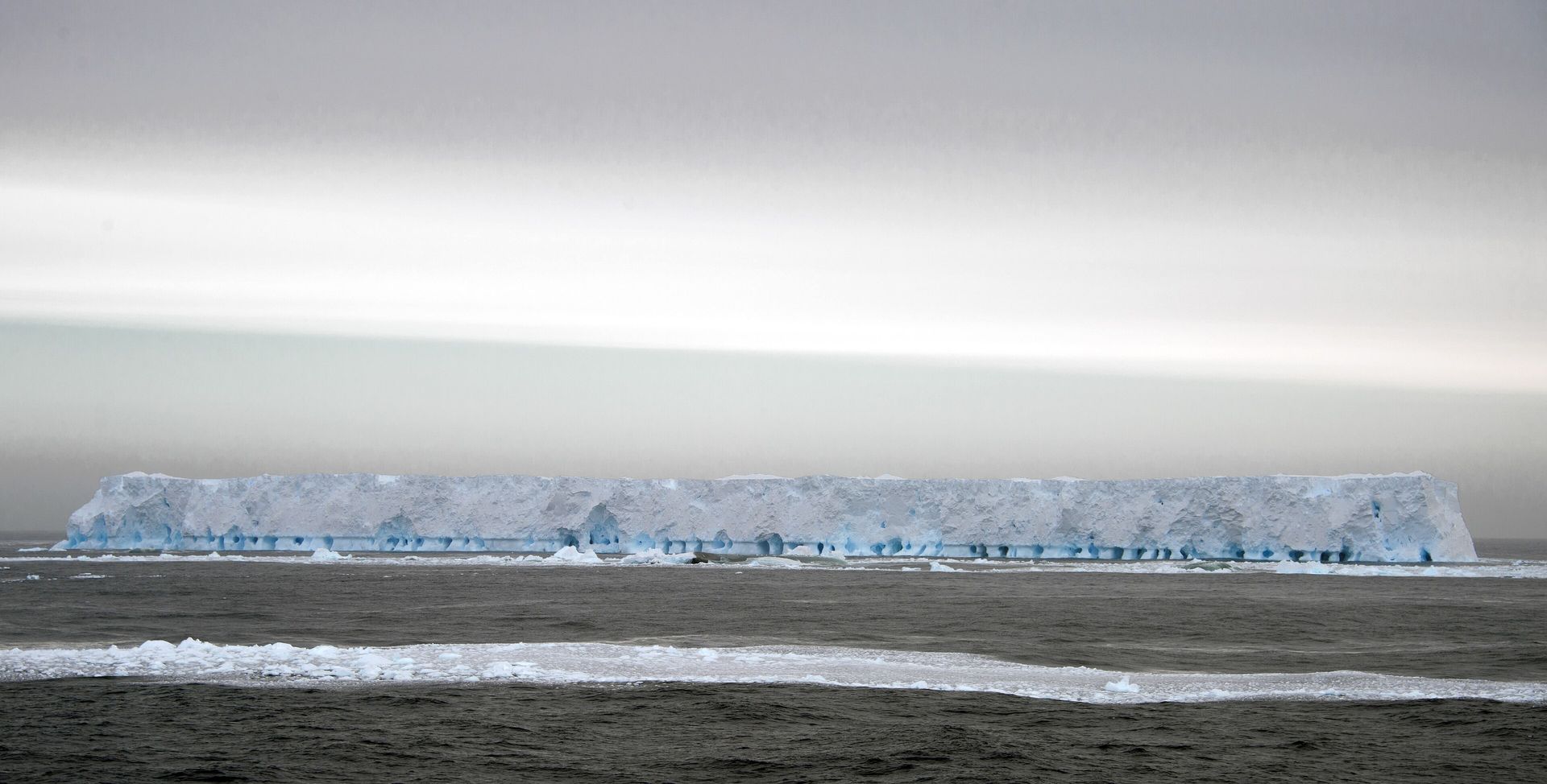 A flat-topped tabular iceberg of about 31 square miles (80 km²) in sea ice in the southwestern Weddell Sea