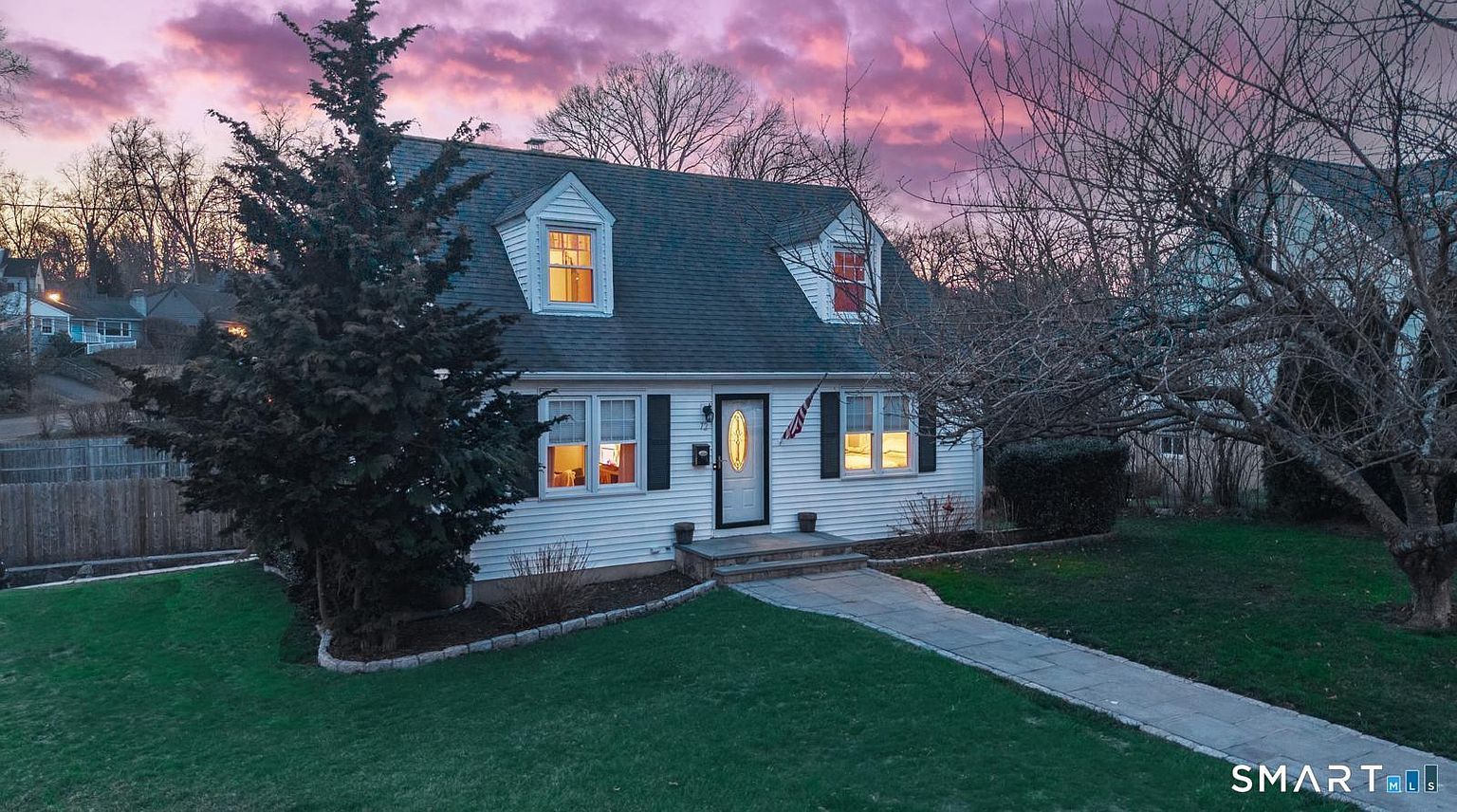 Renovated multi-family home exterior with fresh paint