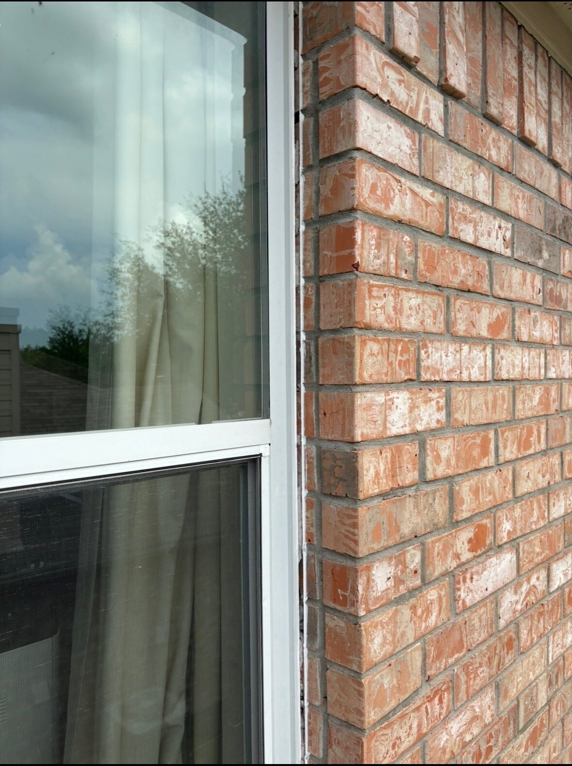 Before photo of an Austin brick window edge