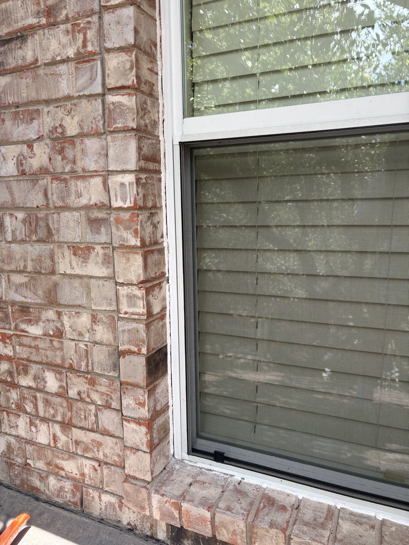 Before photo of a Georgetown brick window lower corner