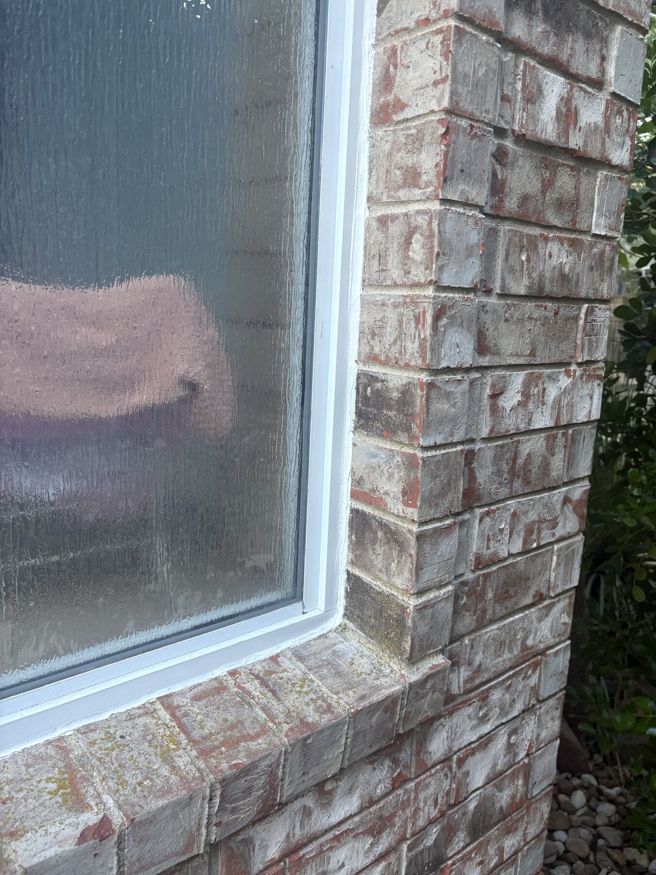 After photo of a Round Rock brick window corner with fresh sealant
