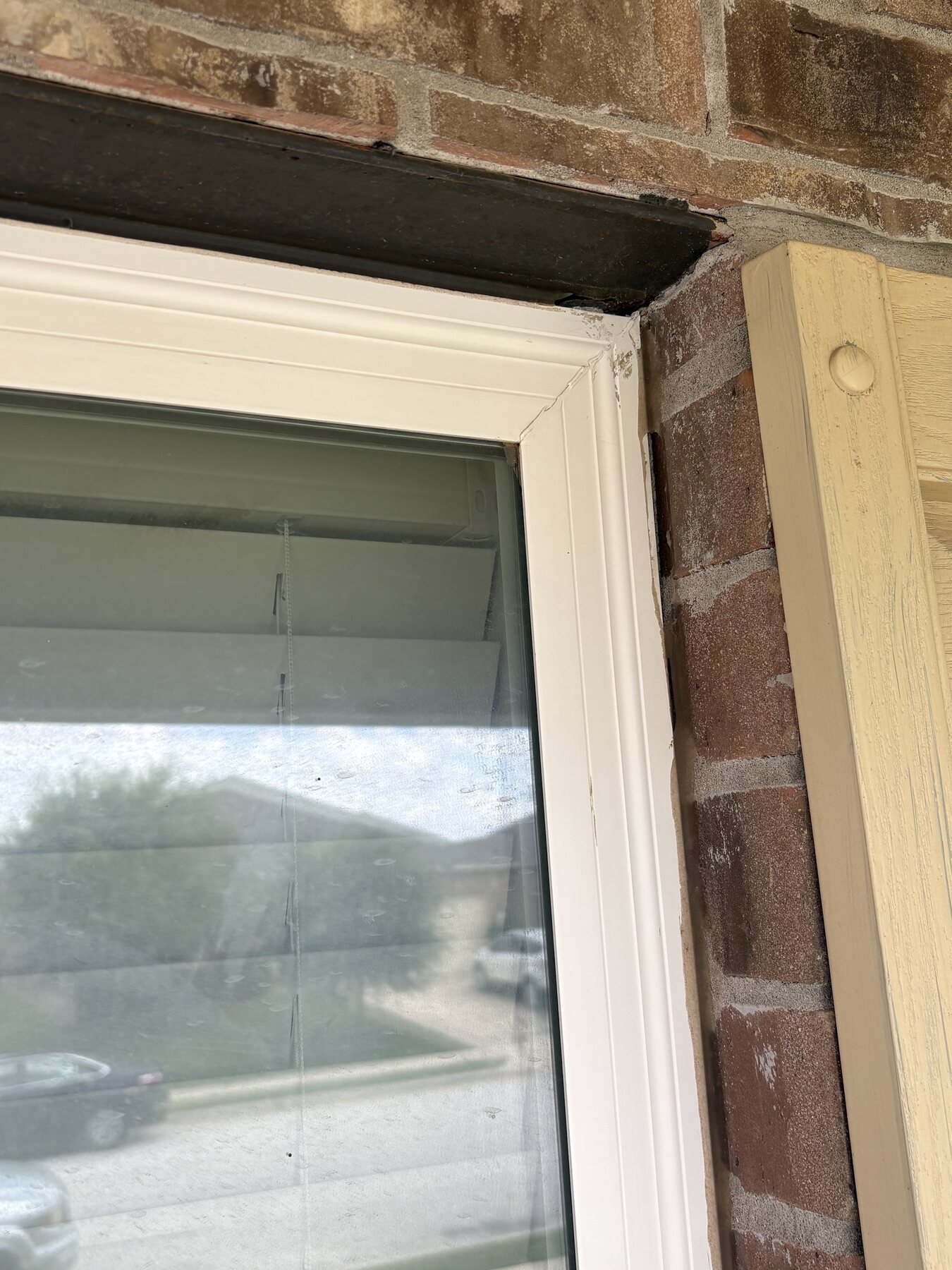 Before photo of a Rollingwood window corner before masking and sealing