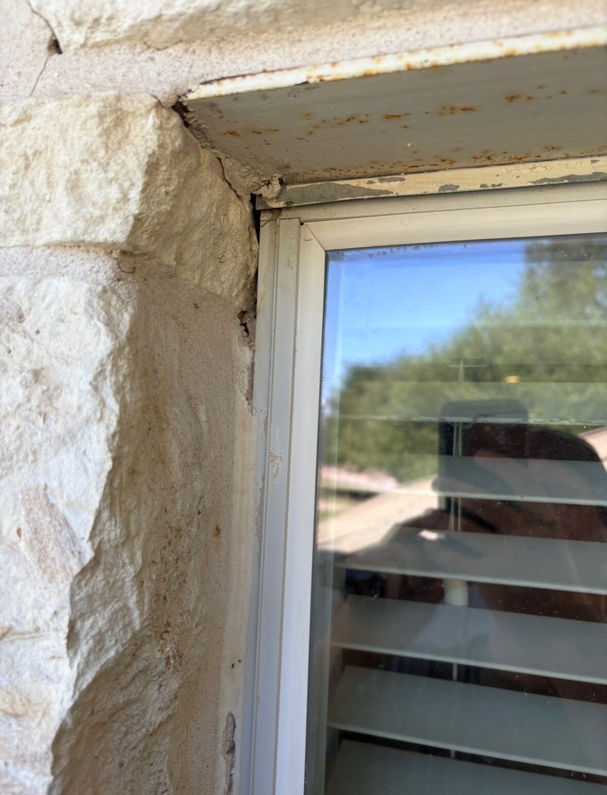 Before photo of cracked sealant around a Hutto window