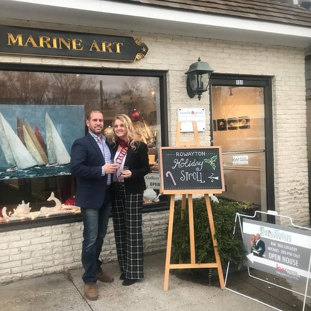 Kim and Mike outside a Rowayton gallery during the Holiday Stroll, beside a Fix and Fashion open house sign