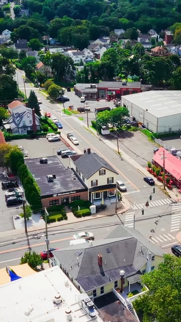 A drone view over a Norwalk neighborhood on listing day