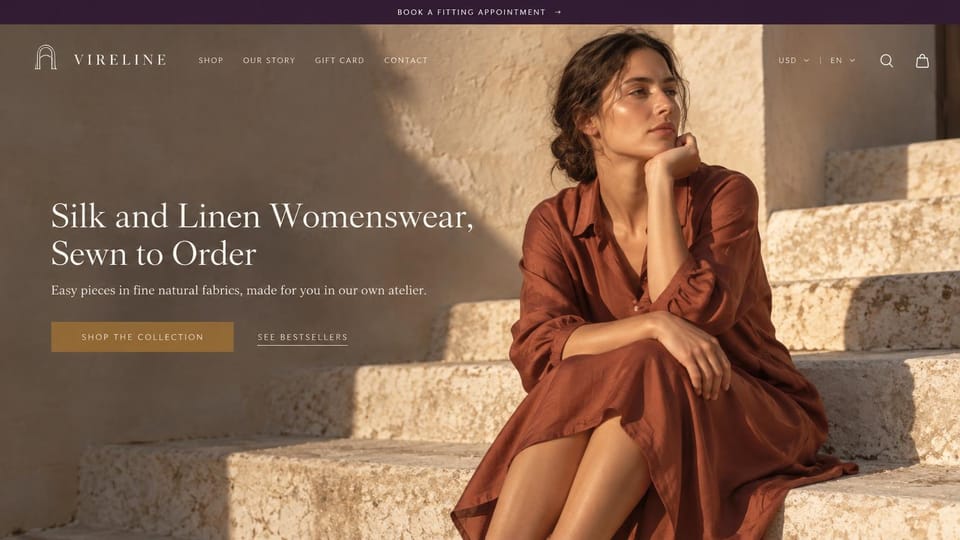 Fashion website design, sewn-to-order silk and linen with fitting appointments: plum top bar, a sunlit stone stairway with a dark-haired woman in a rust silk shirt dress, a white serif headline, an ochre button and an underlined link