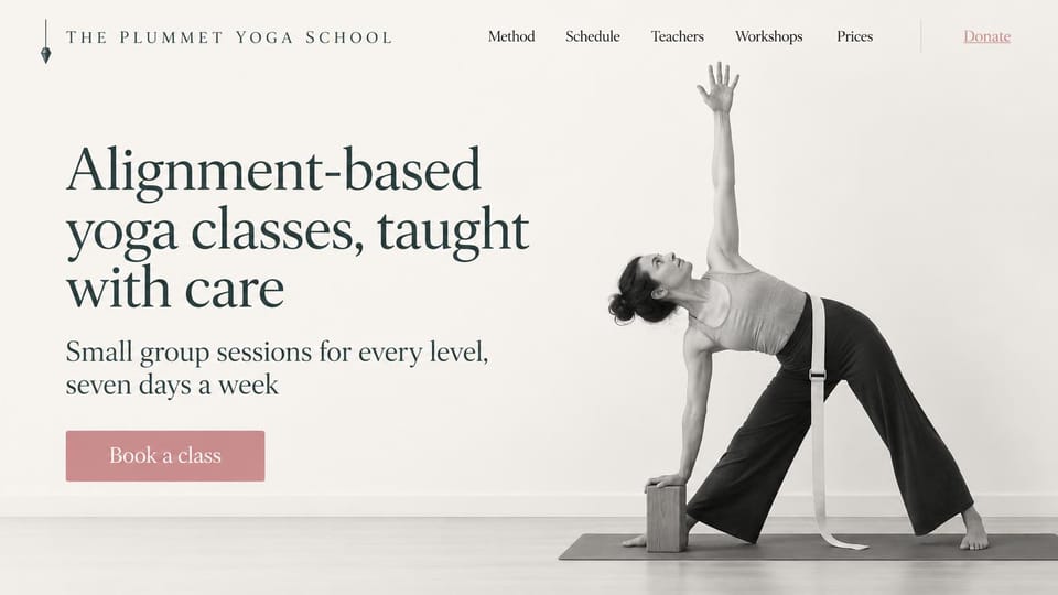 Yoga studio website design, alignment-based yoga school in black and white: ivory page, a dark green serif headline and a muted rose book button beside a black and white photo of a woman in triangle pose with a block and a strap