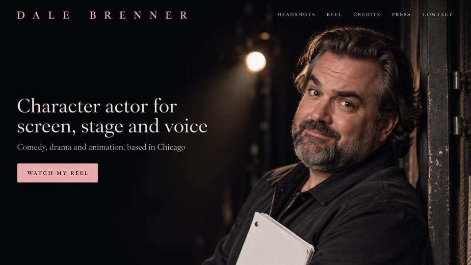 Actor website design, character actor backstage under a stage light: near-black backstage photo, spaced pink capitals, a cream serif headline, a pink reel button and a bearded man holding a script under a stage light