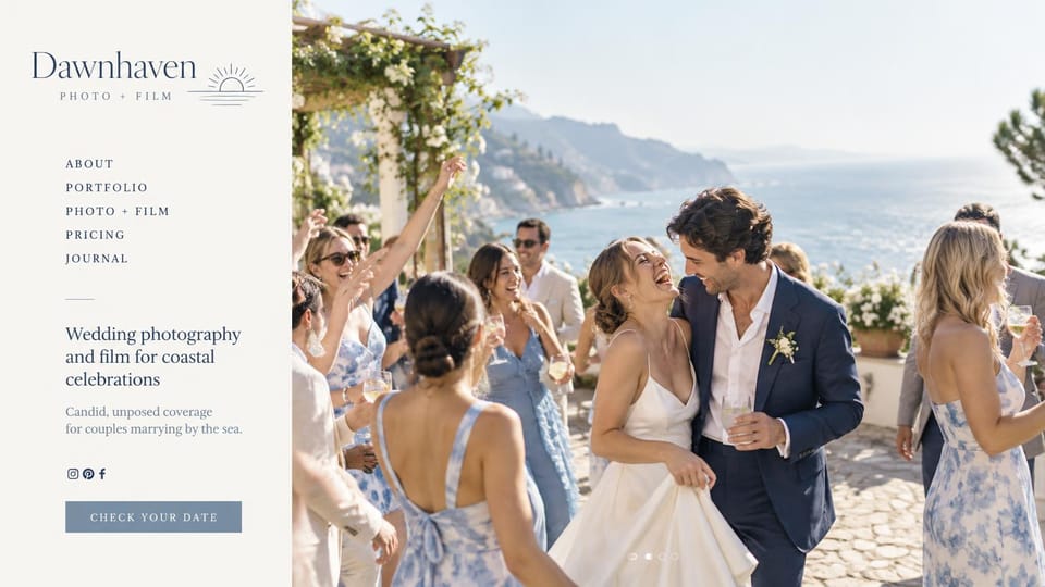 Wedding photographer website design, coastal photo and film studio with an ivory sidebar: warm ivory sidebar with a sunrise logo, a navy serif menu and a dusty blue button, a large sunny clifftop reception photo of a laughing couple with guests in blue florals