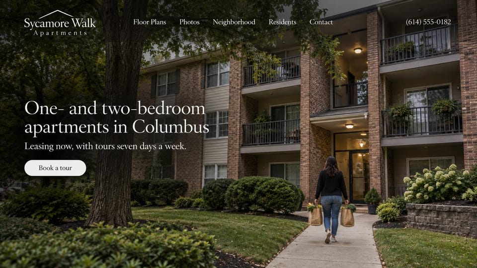 Apartment website design, classic brick complex with a resident coming home: dim photo of a three-story brick building with balconies under a large tree, a woman carrying grocery bags up the path, white serif headline at the left, white tour button