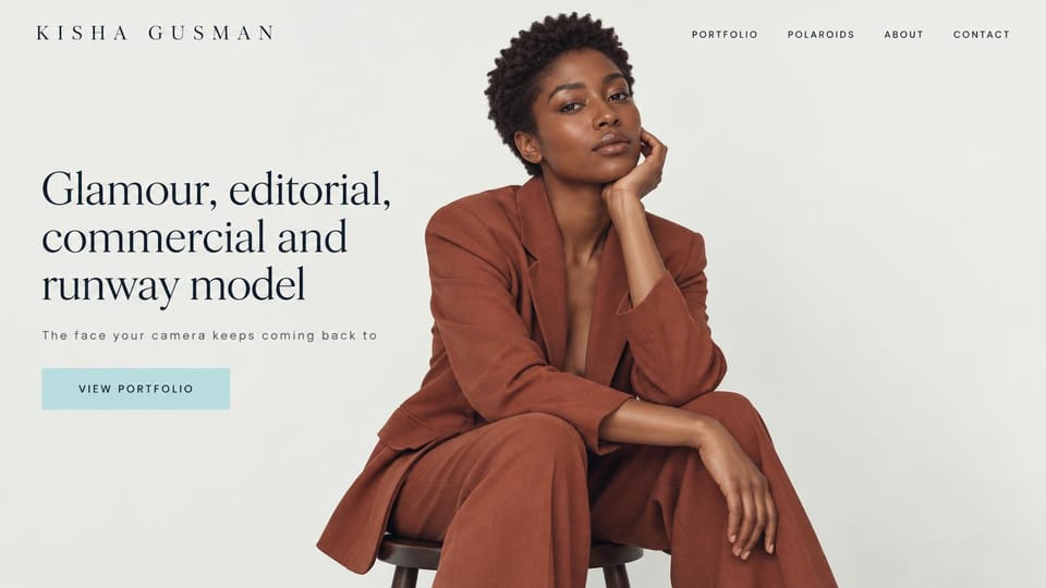 Model portfolio website design, glamour and runway model with a seated studio portrait: pale gray page, spaced dark capitals, a large dark serif headline, a pale blue portfolio button and a woman with short natural hair in a rust suit seated on a stool