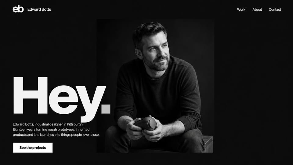 Portfolio website design, industrial designer with a one-word hello: black page, a giant white hello over a monochrome portrait of a man holding an object, a white button