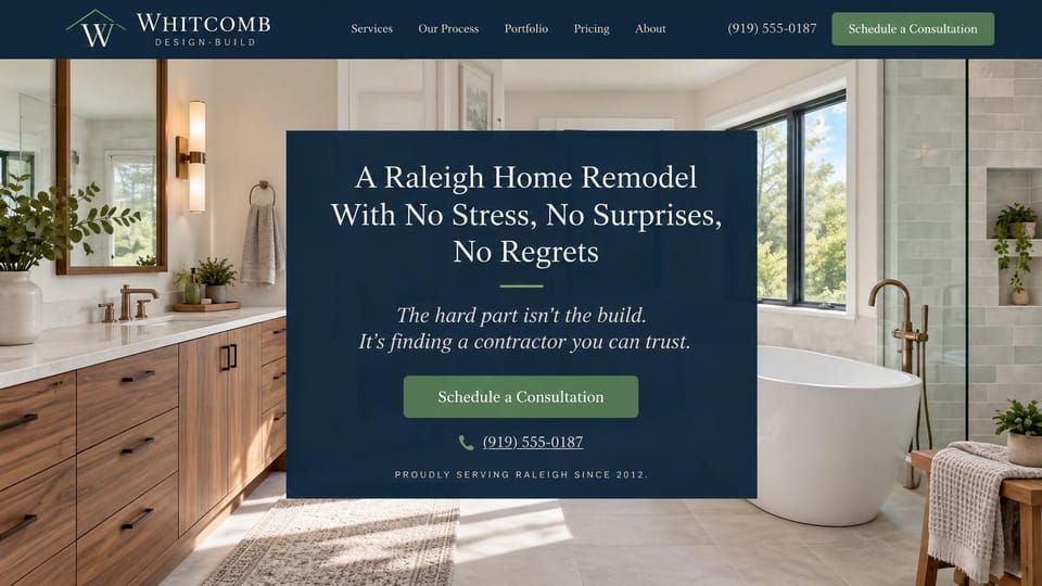Remodeling website design, design-build remodeling in a navy panel: a bright bathroom with a freestanding tub and wood vanity, a centered navy panel with a white serif headline and a green consultation button