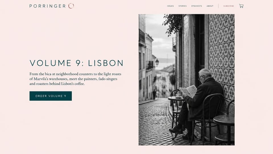 News and magazine website design, coffee magazine with one city per issue: pale pink page, spaced dark teal capitals for the wordmark and issue title, black-and-white photo of an old man reading a newspaper at a cafe table by a tiled wall on a cobbled street