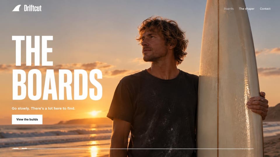 Artist website design, handmade surfboards by the shaper: a surfboard shaper holding a board on a beach at sunset, an oversized white condensed headline on the left