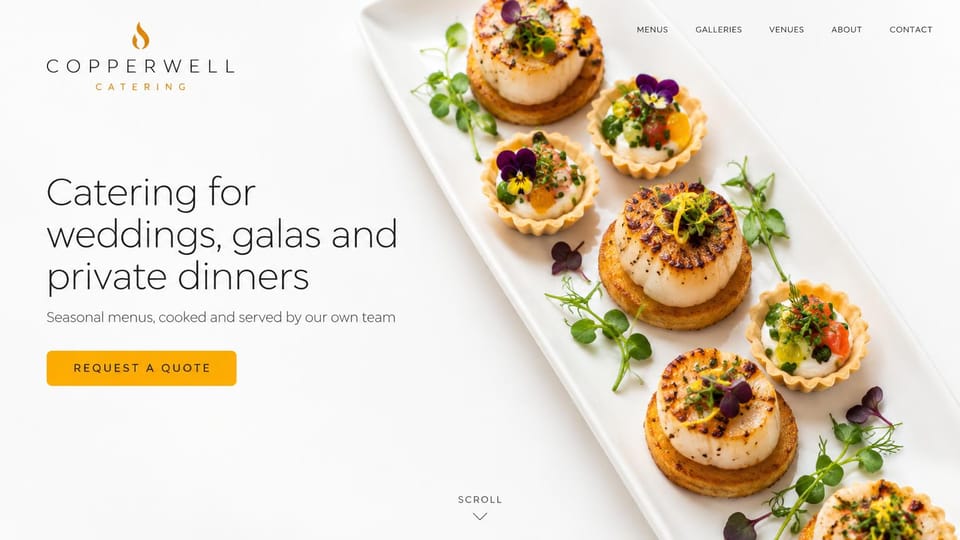 Catering website design, wedding and gala catering on a clean white page: white page, a thin charcoal headline, a gold quote button and a long white platter of scallop tartlets with edible flowers