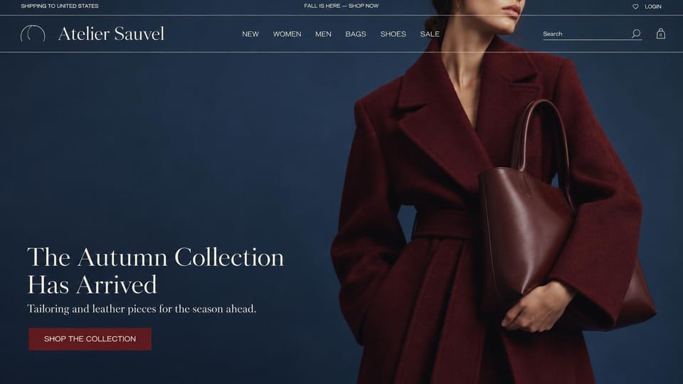 Fashion website design, coats and leather bags on a deep navy page: navy page, a woman cropped at the chin in a burgundy wrap coat with a burgundy leather bag, a white serif headline and a burgundy button at lower left