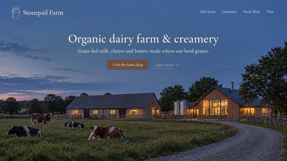 Farm website design, dairy and creamery at dusk: deep blue dusk sky, centered white serif headline, a lit stone farmhouse and barn with cows grazing beside a gravel lane