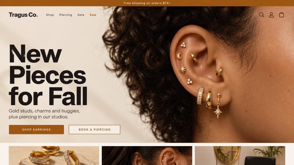 Jewelry website design, earrings and ear piercing in bold type: cream page, an oversized black headline beside a close-up of an ear with gold studs and hoops, a rust button and an outline button