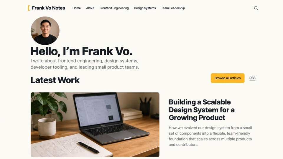 Developer portfolio website design, front-end engineer who writes: cream page, a round portrait, a bold black hello, a yellow articles button and a photo of a laptop on a desk