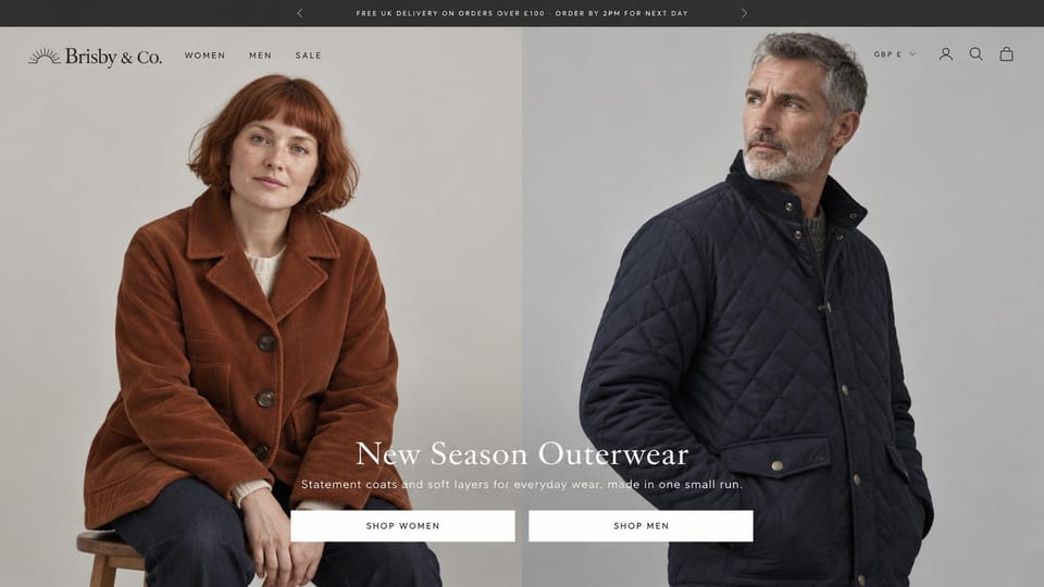 Fashion website design, everyday jackets with shop women and shop men buttons: dark top bar, a red-haired woman in a rust corduroy jacket and a gray-haired man in a navy quilted jacket on a gray wall, a white serif headline and two white buttons