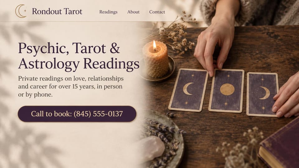 Astrology website design, psychic and tarot readings with moon cards: cream fade over a wooden table where hands lay out three purple moon cards beside a candle, a dark serif headline and a plum call button