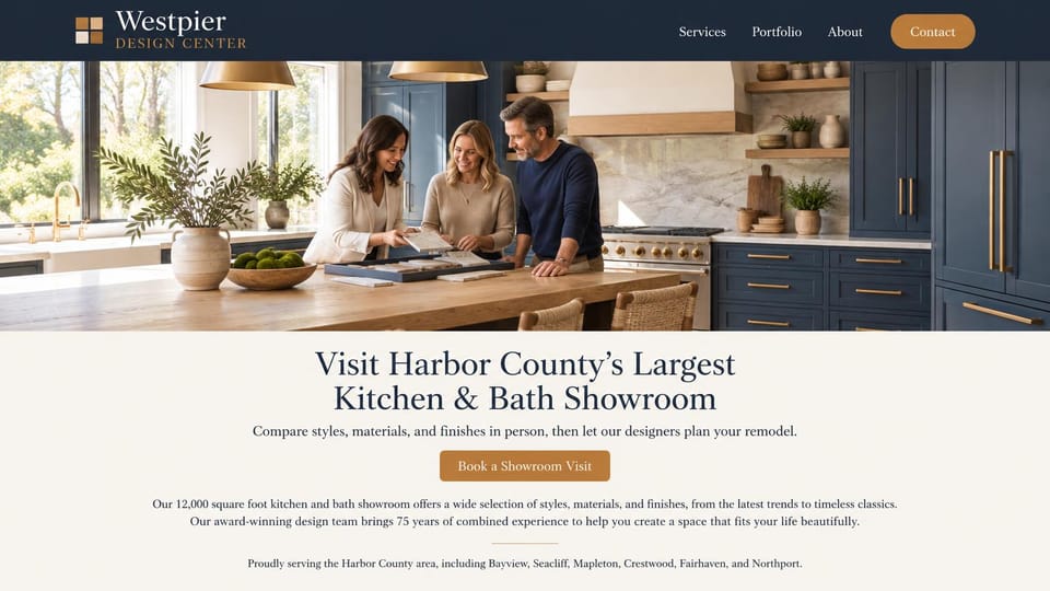 Remodeling website design, kitchen and bath showroom with design services: a navy header, a photo of a designer showing tile samples to a couple at a kitchen island, a centered serif headline and a copper button