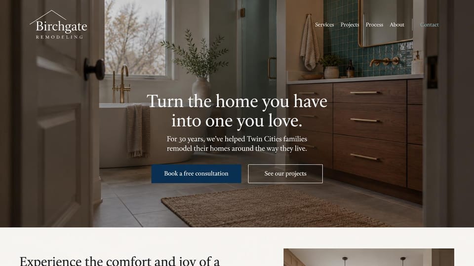 Remodeling website design, established remodeler with a quiet serif: a dark bathroom seen through an open door, a centered white serif headline, a navy consultation button and an outlined projects button