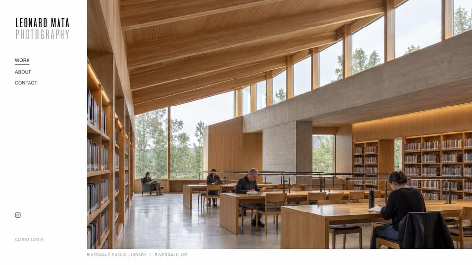 Photography website design, architecture with a slim side menu: white sidebar beside a large photo of a timber library with tall windows and readers at tables