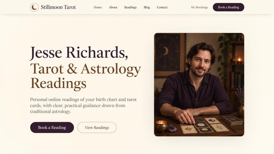 Astrology website design, online tarot and birth charts with a framed portrait: cream page, a large plum and brown serif headline, a plum button and an outlined one beside a framed photo of a reader at a table of cards