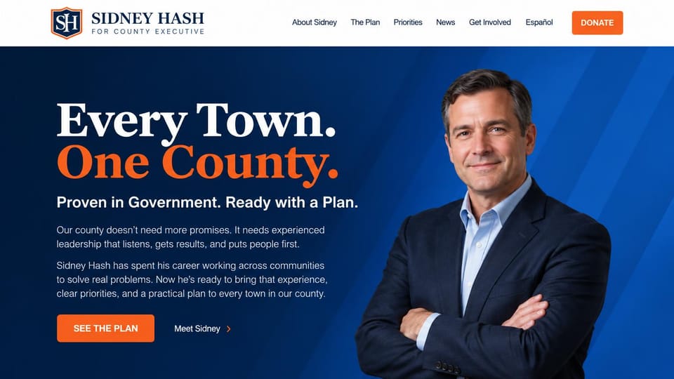 Landing page website design, county executive in blue and orange: navy and bright blue hero, a large white and orange serif headline, a man in a suit with arms crossed, an orange donate button