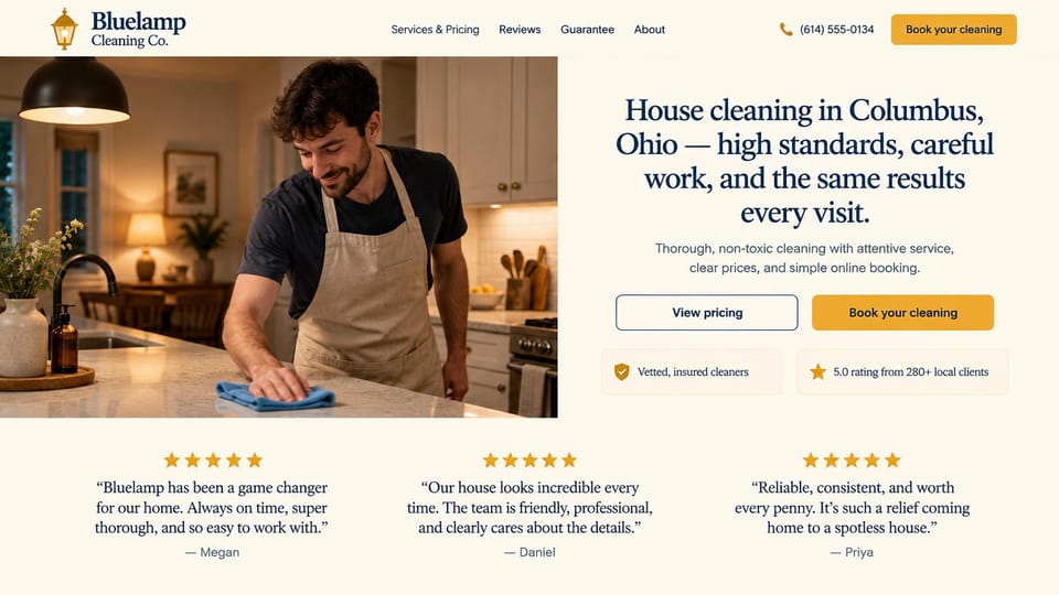 Cleaning service website design, house cleaning with reviews under a lamp-lit kitchen: cream page, a lamp-lit kitchen photo of a man in an apron wiping the counter beside a navy serif headline, outlined and gold buttons and three reviews below