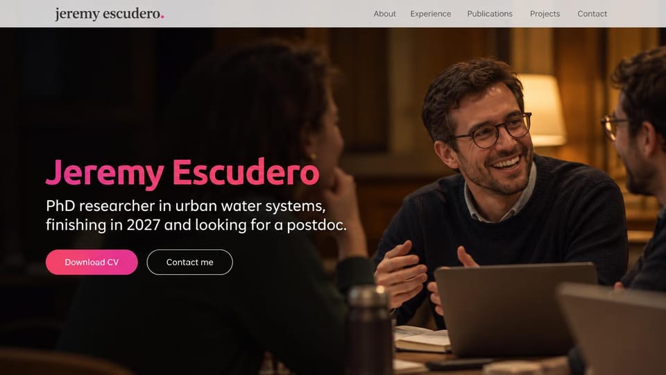 Resume website design, phD researcher with a full-width group discussion photo: warm dark full-width photo of a smiling man in glasses talking with colleagues at a table, a pink gradient name, white text, a pink download CV button and an outlined contact button