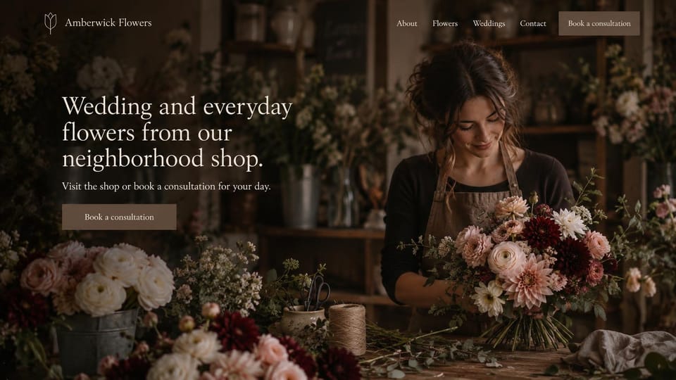 Florist website design, moody neighborhood shop for weddings and every day: dark photo of a florist arranging dahlias and roses in a dim shop, white serif headline, muted consultation button