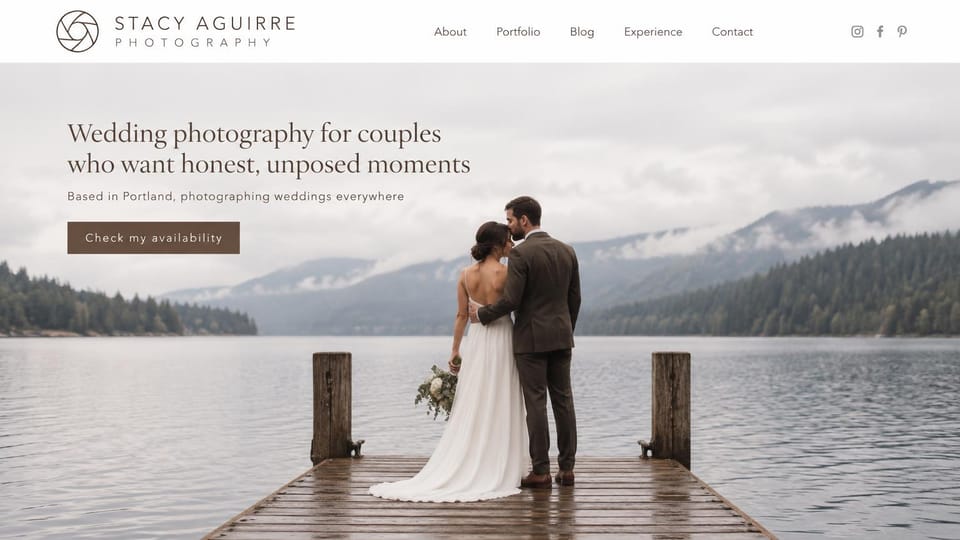 Wedding photographer website design, lake wedding photographer in soft overcast light: white header with an aperture logo and social icons, a couple embracing at the end of a lake dock under misty mountains, a brown serif headline and a brown button