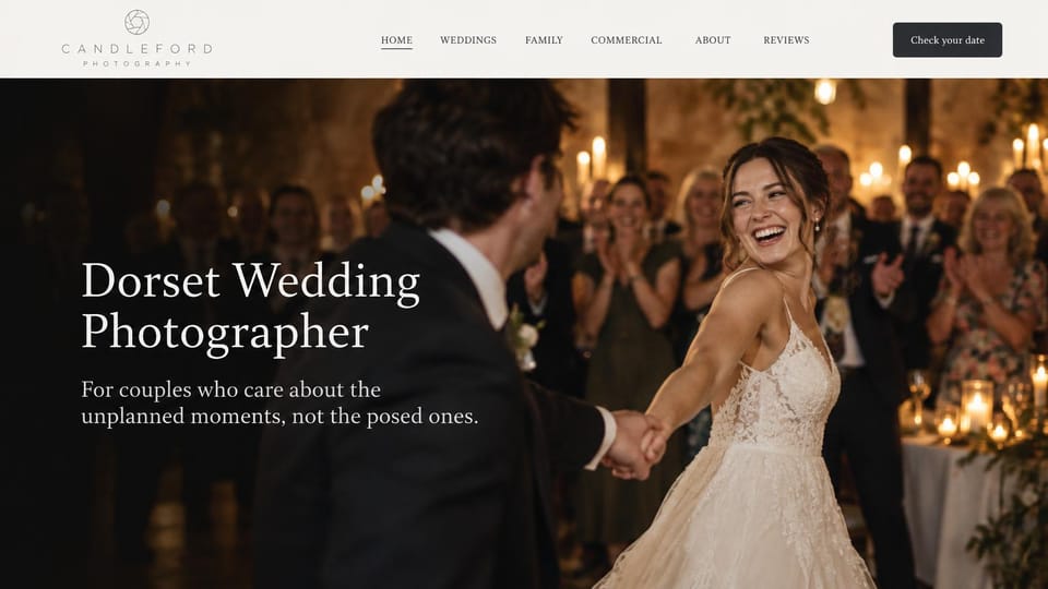 Wedding photographer website design, regional wedding photographer with a candlelit first dance: pale header with an aperture logo and a charcoal date button, a full-width candlelit reception photo of a laughing bride twirling with the groom, a white serif headline