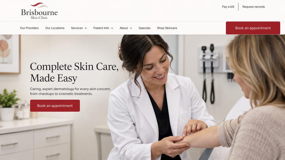 Medical practice website design, skin clinic with specials and a skincare shop: warm white page, a charcoal serif headline and deep red book button over a dermatologist examining a woman's wrist