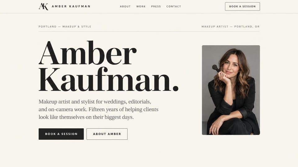 Makeup artist website design, editorial makeup artist with her name as the headline: cream page, the artist's name in a giant black serif, a framed portrait of a woman holding a makeup brush, black buttons