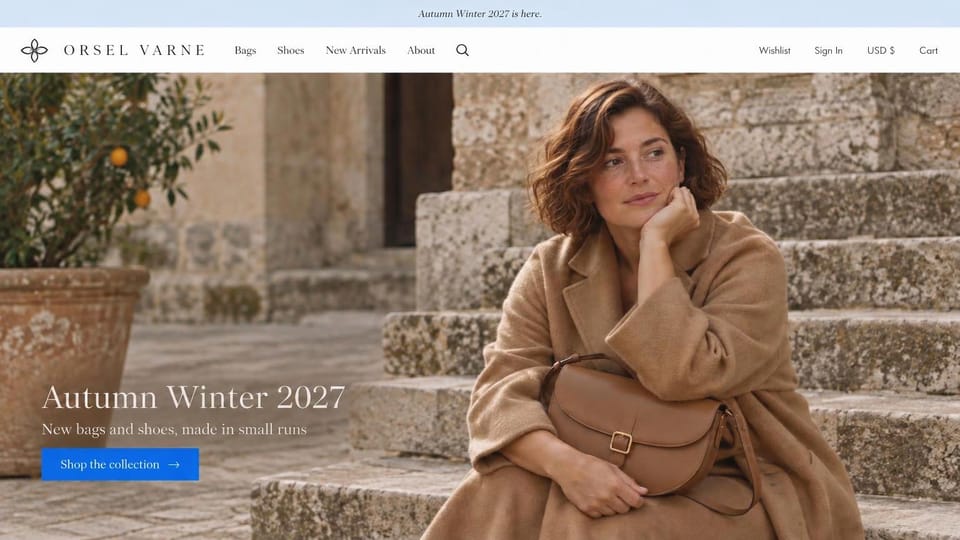 Fashion website design, handbags and shoes on sunlit stone steps: pale blue top bar, a woman in a camel coat on sunlit stone steps with a tan leather saddle bag, a white serif headline and a bright blue button