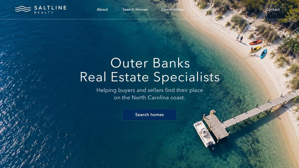 Real estate website design, beach town specialists from above: aerial view of turquoise water, a beach and a dock behind a centered white headline and a navy button