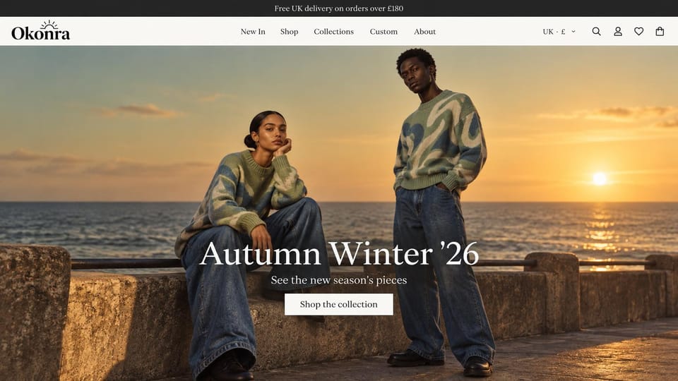Fashion website design, swirl-print knits on a seafront at sunset: white header, a woman seated and a man standing on a sea wall at sunset in green swirl-print sweaters and wide jeans, a large white serif headline and a white button