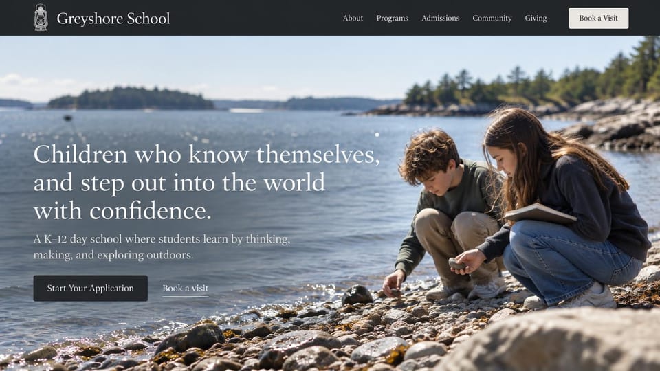 School website design, k-12 day school on a rocky shore: dark header, two students crouching on a rocky shore by the water, a large white serif headline, a dark apply button