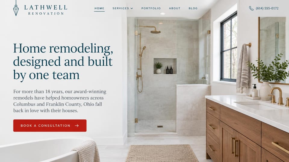 Remodeling website design, design-build remodeler with a bright bathroom: white page, a navy serif headline and a red button beside a bright bathroom with brass fixtures and a walnut vanity