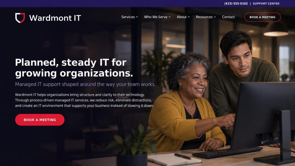 IT company website design, managed IT for growing organizations in a warm office: purple top bar, dark warm photo of a technician and an older client at a monitor, white headline, red meeting button