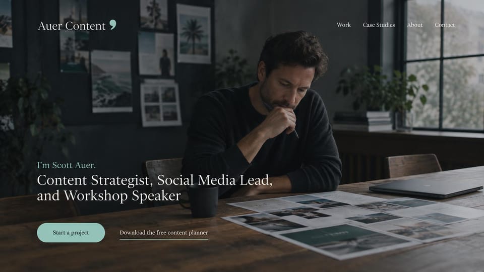 Marketing portfolio website design, content and social lead with a free planner: dark charcoal room, a man thinking over printed layouts at a long wooden table, a white serif headline and a mint button
