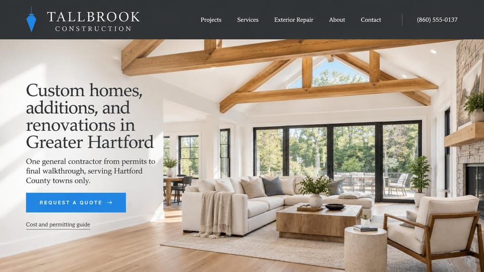 Construction website design, custom homes and additions under exposed beams: charcoal menu, a bright living room with exposed wood trusses and glass doors to the trees, a large charcoal serif headline and a blue button
