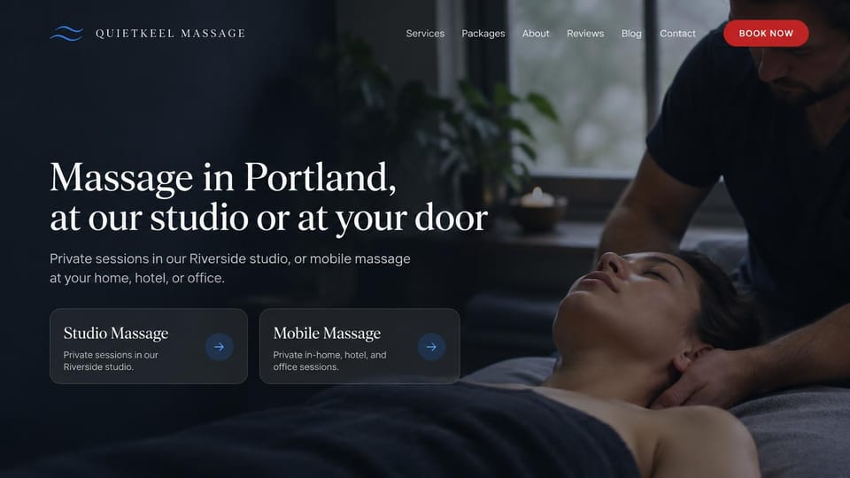 Massage therapist website design, studio and mobile massage in dark navy: dark navy photo of a therapist cradling a client's head, a white serif headline, two glassy cards and a red book button
