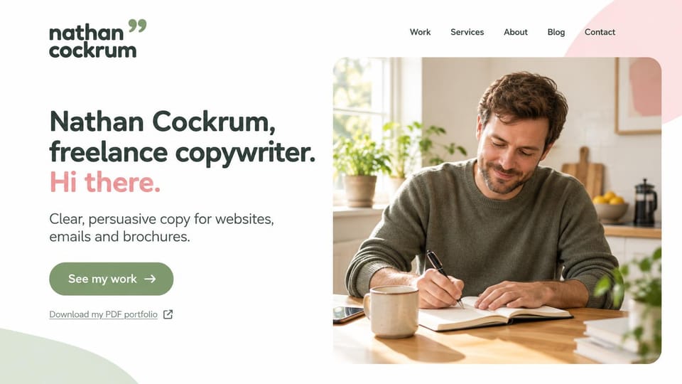 Writer website design, freelance copywriter with a PDF portfolio link: white page, a dark green name and headline with a pink hello, a sage button and a rounded photo of a man writing at a kitchen table