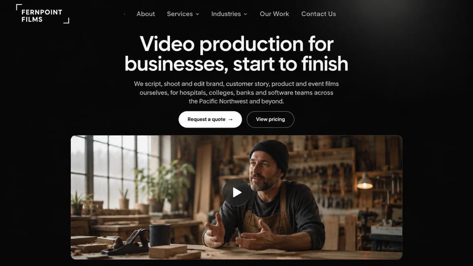 Videographer website design, business video production with a video still under the headline: black page, a large centered white headline, a white quote button and an outlined pricing button, a wide rounded still of a craftsman talking in a workshop with a play button